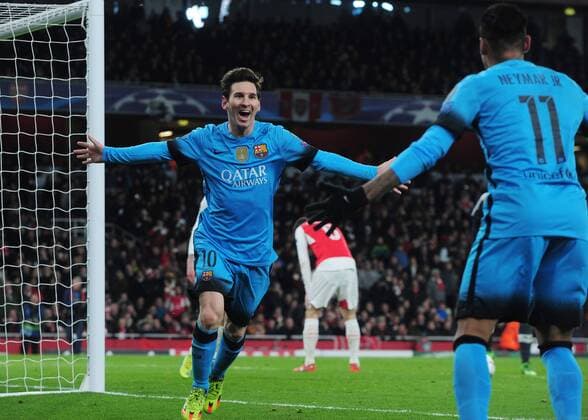 Football - 2015 2016 Champions League - Round of 16, First Leg: Arsenal vs. Barcelona Lionel Messi of Barcelona celebrates scoring goal no 1 at The Emirates. COLORSPORT ANDREW COWIE 
