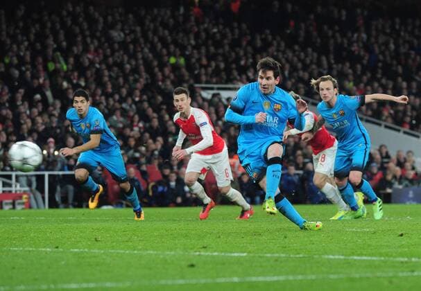 Football - 2015 2016 Champions League - Round of 16, First Leg: Arsenal vs. Barcelona Lionel Messi of Barcelona scores goal no 2 from the penalty spot at The Emirates. COLORSPORT ANDREW COWIE 