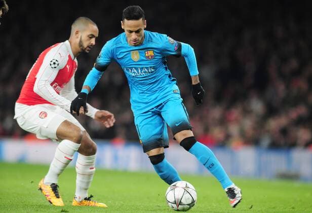 Football - 2015 2016 Champions League - Round of 16, First Leg: Arsenal vs. Barcelona Neymar of Barcelona and Theo Walcott of Arsenal at The Emirates. COLORSPORT ANDREW COWIE 