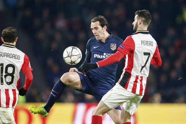 (L-R) Andres Guardado of PSV, Diego Godin of Club Atletico de Madrid, Gaston Pereiro of PSV during the UEFA Champions League Round of 16, First leg match between PSV Eindhoven and Atletico Madrid on February 24, 2016 at the Philips stadium in Eindhoven, The Netherlands. PSV v Atletico Madrid UEFA Champions League 2015 2016 xVIxxIVx 5037517