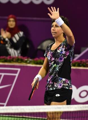 DOHA, Feb. 25, 2016 -- Carla Suarez Navarro of Spain reacts during the women s singles quarterfinal match against Elena Vesnina of Russia at the WTA Tennis Damen Qatar Open 2016 in Doha, Qatar, Feb. 25, 2016. Carla Suarez Navarro won 2-0. ) (SP)QATAR-DOHA-TENNIS-WTA QATAR OPEN 2016 Nikku 