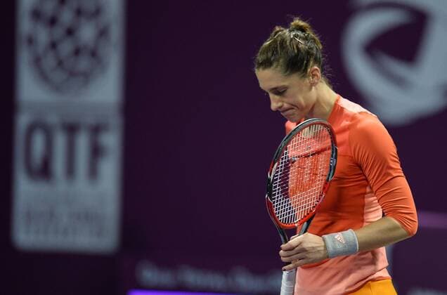 (160227) -- DOHA, Feb. 26, 2016 -- Andrea Petkovic of Germany reacts during the women s singles semi-final match against Jelena Ostapenko of Latvia at the WTA Tennis Damen Qatar Total Open 2016 in Doha, Qatar Feb. 26, 2016. Jelena Ostapenko won 7-5, 1-0 after Andrea Petkovic abandoned due to an injury. ) (SP)QATAR-DOHA-TENNIS-WTA QATAR OPEN 2016 Nikku 