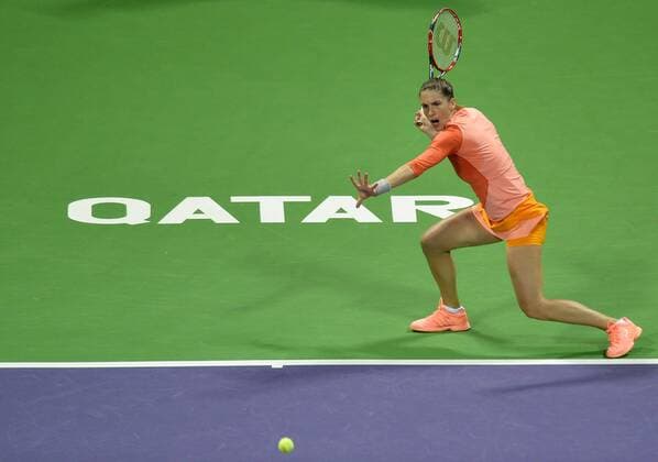 (160227) -- DOHA, Feb. 26, 2016 -- Andrea Petkovic of Germany returns the ball during the women s singles semi-final match against Jelena Ostapenko of Latvia at the WTA Tennis Damen Qatar Total Open 2016 in Doha, Qatar Feb. 26, 2016. Jelena Ostapenko won 7-5, 1-0 after Andrea Petkovic abandoned due to an injury. ) (SP)QATAR-DOHA-TENNIS-WTA QATAR OPEN 2016 Nikku 