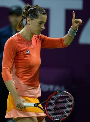 (160227) -- DOHA, Feb. 26, 2016 -- Andrea Petkovic of Germany reacts during the women s singles semi-final match against Jelena Ostapenko of Latvia at the WTA Tennis Damen Qatar Total Open 2016 in Doha, Qatar Feb. 26, 2016. Jelena Ostapenko won 7-5, 1-0 after Andrea Petkovic abandoned due to an injury. ) (SP)QATAR-DOHA-TENNIS-WTA QATAR OPEN 2016 Nikku 