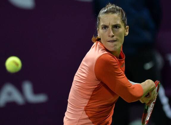 (160227) -- DOHA, Feb. 26, 2016 -- Andrea Petkovic of Germany returns the ball during the women s singles semi-final match against Jelena Ostapenko of Latvia at the WTA Tennis Damen Qatar Total Open 2016 in Doha, Qatar Feb. 26, 2016. Jelena Ostapenko won 7-5, 1-0 after Andrea Petkovic abandoned due to an injury. ) (SP)QATAR-DOHA-TENNIS-WTA QATAR OPEN 2016 Nikku 