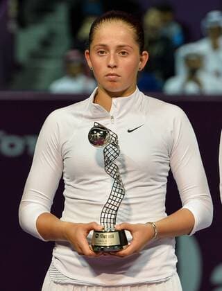 Jelena Ostapenko of Latvia poses with her runner up trophy after the women s final match against Carla Suarez Navarro of Spain at the WTA Tennis Damen Qatar Total Open 2016 at the International Khalifa Tennis Complex Doha, Qatar February 27, 2016. Carla Suarez Navarro won 2-1 and claimed the title. ) (SP)QATAR-DOHA-TENNIS-WTA QATAR OPEN 2016 Nikku 