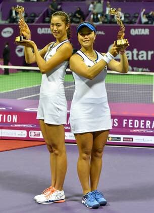 Hao-Ching Chan (L) of Chinese Taipei and Yung-Jan Chan of Chinese Taipei pose with their trophies after winning the doubles final match against Sara Errani of Italy and Carla Suarez Navarro of Spain at the WTA Tennis Damen Qatar Total Open 2016 at the International Khalifa Tennis Complex Doha, Qatar February 27, 2016. Hao-Ching Chan and Yung-Jan Chan won 2-0 and claimed the title. ) (SP)QATAR-DOHA-TENNIS-WTA QATAR OPEN 2016 Nikku 