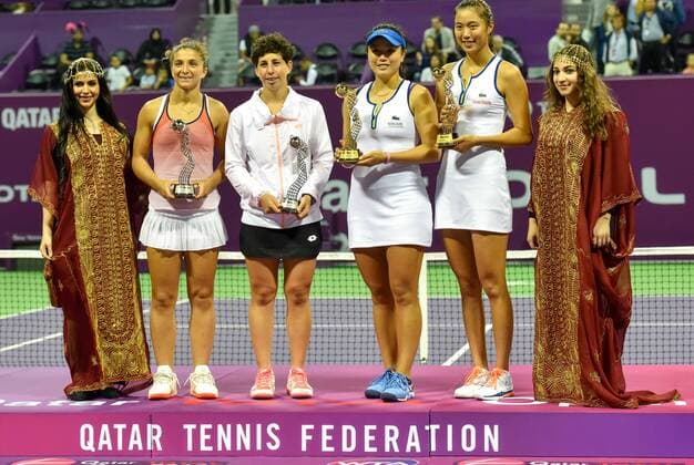 Sara Errani(2nd, L) of Italy, Carla Suarez Navarro(3rd, L) of Spain and Hao-Ching Chan(2nd, R) of Chinese Taipei and Yung-Jan Chan(3rd, R) of Chinese Taipei react at the awarding ceremony after the double s final match of WTA Tennis Damen Qatar Total Open 2016 at the International Khalifa Tennis Complex Doha, Qatar February 27, 2016.Hao-Ching Chan and Yung-Jan Chan won 2-0 and claimed the title. ) (SP)QATAR-DOHA-TENNIS-WTA QATAR OPEN 2016 Nikku 