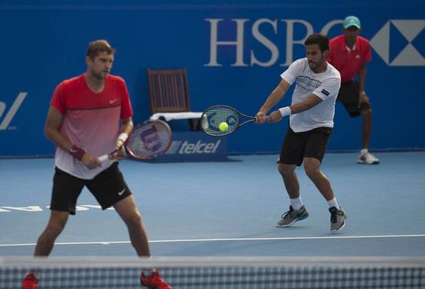 Treat Huey (R) of the Philippines and Max Mirnyi of Belarus compete during the men s doubles final against Phillip Petzschner of Germany and Alexander Peya of Austria at the Mexican Tennis Open 2016 in Acapulco, Mexico, Feb. 27, 2016. Treat Huey and Max Mirnyi won 2-0 to claim the title. Jesus Espinosa) (rtg) (SP)MEXICO-ACAPULCO-TENNIS-MEXICAN OPEN e JESUSxESPINOSA 