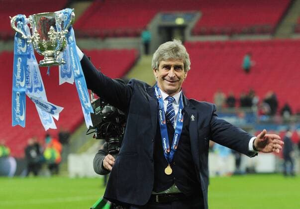 Football - 2016 Capital One League Cup Final - Liverpool vs. Manchester City Manchester City Manager Manuel Pellegrini with the trophy at Wembley. COLORSPORT ANDREW COWIE 