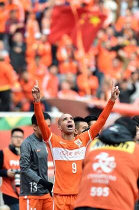 (160301) -- JINAN, March 1, 2016 -- Diego Tardelli of China s Shandong Luneng FC celebrates for goal during the group F match against Thailand s Buriram United at the AFC Champions League 2016 in Ji nan, east China s Shandong Province, on March 1, 2016. Shandong Luneng FC won 3-0. ) (lm) (SP)CHINA-JINAN-FOOTBALL-AFC CHAMPIONS LEAGUE (CN) XuxSuhui 