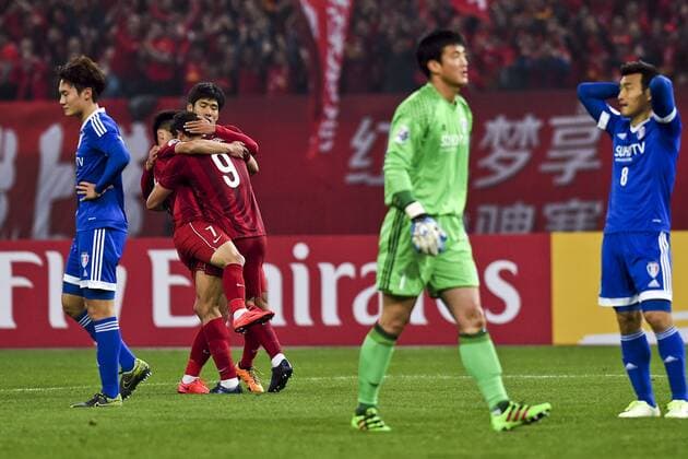 SHANGHAI, CHINA - MARCH 02: (CHINA OUT) Elkeson 9 of Shanghai SIPG celebrates with team mates after scoring his team s first goal during the AFC Champions League Group G match between Shanghai SIPG and Suwon Samsung Bluewings at Shanghai Stadium on March 2, 2016 in Shanghai, China.  CFP480513710 