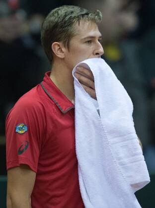 Belgian Kimmer Coppejans performs during the first game, a single game between Belgian Kimmer Coppejans ATP Tennis Herren 122) and Croatian Marin Cilic (ATP 12) on the first day of the Davis Cup first round World Group meeting between Belgium and Croatia, Friday 04 March 2016, in Angleur, Liege. The first round will be played from 04 to 06 March 2016, Liege. BENOITxDOPPAGNE  x04804445x