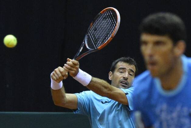 Croatian Ivan Dodig and Croatian Franko Skugor pictured during the third game, a double game between Belgians David Goffin and Ruben Bemelmans and Croatians Ivan Dodig and Franko Skugor, on the second day of the Davis Cup first round World Group meeting between Belgium and Croatia, Saturday 05 March 2016, in Angleur, Liege. BENOITxDOPPAGNE  x04804972x