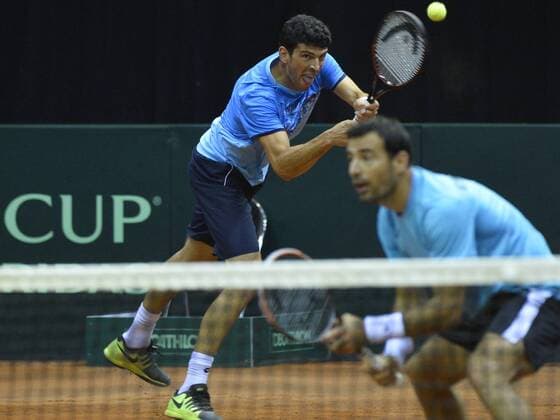 Croatian Franko Skugor and Croatian Ivan Dodig pictured during the third game, a double game between Belgians David Goffin and Ruben Bemelmans and Croatians Ivan Dodig and Franko Skugor, on the second day of the Davis Cup first round World Group meeting between Belgium and Croatia, Saturday 05 March 2016, in Angleur, Liege. BENOITxDOPPAGNE  x04804974x