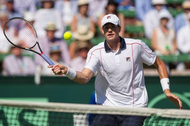 (160306) -- MELBOURNE, Mar. 6, 2016 -- John Isner of USA returns the ball during his men s singles match against Bernard Tomic of Australia during Davis Cup by BNP Paribas World Group first round tie between Australia and USA at Kooyong Lawn Tennis Club in Melbourne, Australia, Mar. 6, 2016. John Isner won 3-1, making USA won Australia with 3-1. ) (SP)AUSTRALIA-MELBOURNE-TENNIS-DAVIS CUP BaixXue 