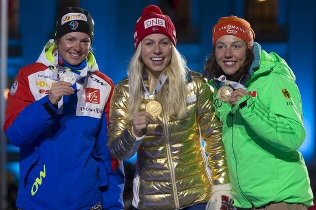 05.03.2016. Oslo Holmenkollen, Oslo, Norway. IBU Biathlon World Cup. Day One. Marie Dorin Habert of France second place, Tiril Eckhoff of Norway first place and Laura Dahlmeier of Germany third place winner of ladies 7.5km at the medal ceremony during the IBU World Championships Biathlon in Holmenkollen Oslo, Norway. xNigelxWaldronx  ActionPlus11715026
