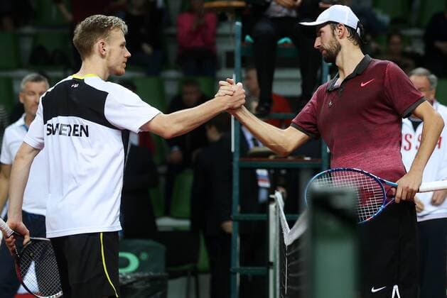 Tennis, Davis Cup, Russland - Schweden KAZAN, RUSSIA. MARCH 6, 2016. Sweden s tennis player Daniel Windahl (L) and Russia s tennis player Konstantin Kravchuk shake hands in Rubber 5 of the Davis Cup Group I Europe Africa Zone 1st Round tie between Sweden and Russia at Kazan Tennis Academy. Kravchuk won 6-2, 6-2. Russia won the tie 5-0. Yegor Aleyev TASS  TS018B3E