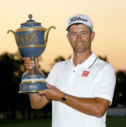 Scott wins Cadillac Championship golf tournament Adam Scott of Australia holds the winner s trophy after winning the Cadillac Championship golf tournament in Doral, Florida, on March 6, 2016. 