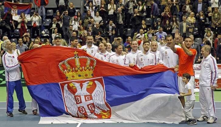 BELGRADE, March 6, 2016 -- Serbia s tennis players pose for a photo with national flag after defeating Kazakhstan during the Davis Cup World Group first round match between Serbia and Kazakhstan at Aleksandar Nikolic hall in Belgrade, on March 6, 2016. Troicki won 3-0 in the final match and brought overall victory over Kazakhstan. Serbia will compete with Great Britain in quarterfinals scheduled for July 15-17.) (SP)SERBIA-BELGRADE-TENNIS-DAVIS CUP-SERBIA VS KAZAKHSTAN PredragxMilosavljevic 