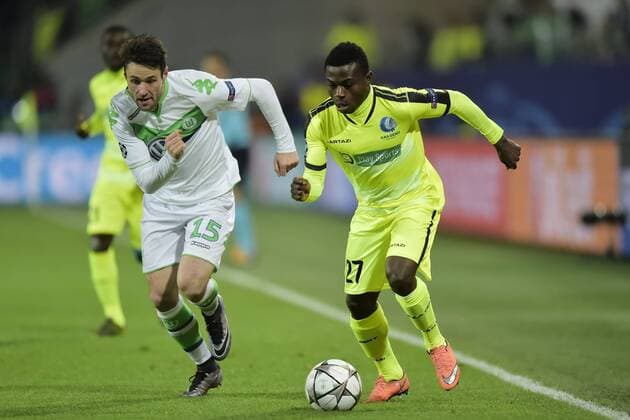 Simon Moses Daddy Ajala forward of KAA Gent in action with Christian Trasch midfielder of VfL Wolfsburgduring the Champions League Round of 16, second leg match between VfL Wolfsburg and KAA Gent at the Volkswagen Arena in Wolfsburg, Germany. FOOTBALL : Wolfsbourg vs La gantoise - Ligue des Champions - 08 03 2016 PHOTONEWS PANORAMIC 