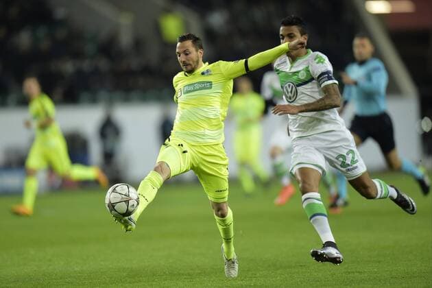Milicevic Danijel midfielder of KAA Gent controls the ball in front of Luiz Gustavo midfielder of VfL Wolfsburgduring the Champions League Round of 16, second leg match between VfL Wolfsburg and KAA Gent at the Volkswagen Arena in Wolfsburg, Germany. FOOTBALL : Wolfsbourg vs La gantoise - Ligue des Champions - 08 03 2016 PHOTONEWS PANORAMIC 