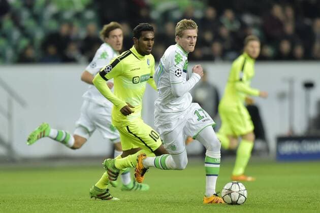 Andre Schurrle midfielder of VfL Wolfsburg in front of Neto Renato Cardoso midfielder of KAA Gent during the Champions League Round of 16, second leg match between VfL Wolfsburg and KAA Gent at the Volkswagen Arena in Wolfsburg, Germany. FOOTBALL : Wolfsbourg vs La gantoise - Ligue des Champions - 08 03 2016 PHOTONEWS PANORAMIC 