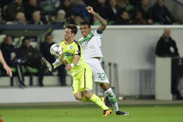 Dejaegere Brecht midfielder of KAA Gent in duel with Luiz Gustavo midfielder of VfL Wolfsburg during the Champions League Round of 16, second leg match between VfL Wolfsburg and KAA Gent at the Volkswagen Arena in Wolfsburg, Germany. FOOTBALL : Wolfsbourg vs La gantoise - Ligue des Champions - 08 03 2016 PHOTONEWS PANORAMIC 