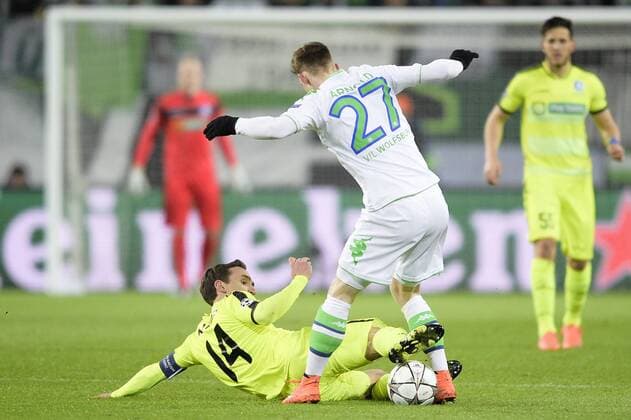 Gent s Sven Kums and Wolfsburg s Maximilian Arnold fight for the ball during a soccer game between German team VfL Wolfsburg and Belgian club KAA Gent, the return game of the 1 8 final s of the UEFA Champions League competition, Tuesday 08 March 2016 in Wolfsburg, Germany. Wolfsburg won the first leg 2-3. YORICKxJANSENS  x04807142x