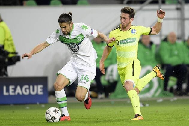 Wolfsburg s Ricardo Rodriguez and Gent s Brecht Dejaegere fight for the ball during a soccer game between German team VfL Wolfsburg and Belgian club KAA Gent, the return game of the 1 8 final s of the UEFA Champions League competition, Tuesday 08 March 2016 in Wolfsburg, Germany. Wolfsburg won the first leg 2-3. YORICKxJANSENS  x04807138x