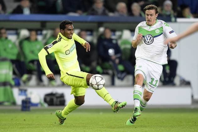 Gent s Renato Neto and Wolfsburg s Max Kruse fight for the ball during a soccer game between German team VfL Wolfsburg and Belgian club KAA Gent, the return game of the 1 8 final s of the UEFA Champions League competition, Tuesday 08 March 2016 in Wolfsburg, Germany. Wolfsburg won the first leg 2-3. YORICKxJANSENS  x04807140x