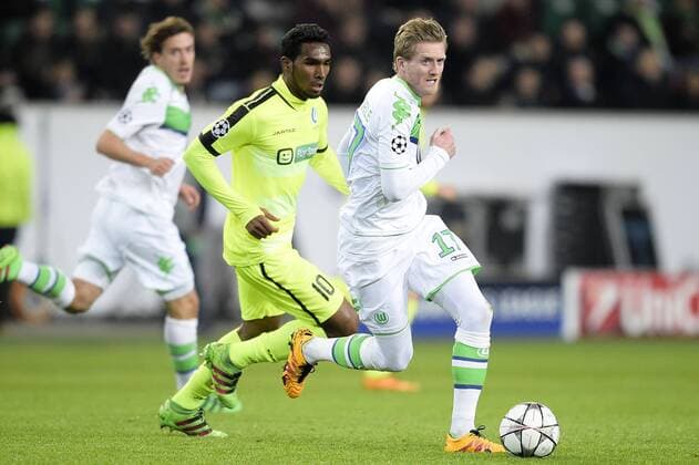 Gent s Renato Neto and Wolfsburg s Andre Schurrle fight for the ball during a soccer game between German team VfL Wolfsburg and Belgian club KAA Gent, the return game of the 1 8 final s of the UEFA Champions League competition, Tuesday 08 March 2016 in Wolfsburg, Germany. Wolfsburg won the first leg 2-3. YORICKxJANSENS  x04807141x