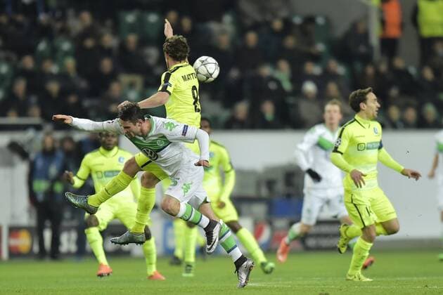 Matton Thomas midfielder of KAA Gent jumps over Christian Trasch midfielder of VfL Wolfsburg during the Champions League Round of 16, second leg match between VfL Wolfsburg and KAA Gent at the Volkswagen Arena in Wolfsburg, Germany. FOOTBALL : Wolfsbourg vs La gantoise - Ligue des Champions - 08 03 2016 PHOTONEWS PANORAMIC 