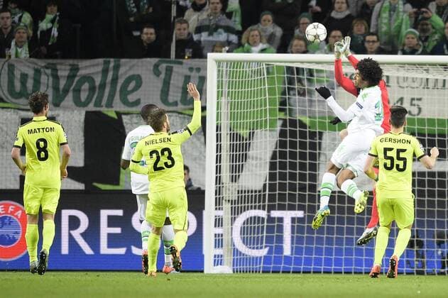 Gent s goalkeeper Matz Sels and Wolfsburg s Dante Bonfim Costa Santos fight for the ball during a soccer game between German team VfL Wolfsburg and Belgian club KAA Gent, the return game of the 1 8 final s of the UEFA Champions League competition, Tuesday 08 March 2016 in Wolfsburg, Germany. Wolfsburg won the first leg 2-3. YORICKxJANSENS  x04807153x