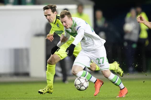 Gent s Sven Kums and Wolfsburg s Maximilian Arnold fight for the ball during a soccer game between German team VfL Wolfsburg and Belgian club KAA Gent, the return game of the 1 8 final s of the UEFA Champions League competition, Tuesday 08 March 2016 in Wolfsburg, Germany. Wolfsburg won the first leg 2-3. YORICKxJANSENS  x04807320x