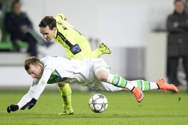 Wolfsburg s Maximilian Arnold and Gent s Sven Kums fight for the ball during a soccer game between German team VfL Wolfsburg and Belgian club KAA Gent, the return game of the 1 8 final s of the UEFA Champions League competition, Tuesday 08 March 2016 in Wolfsburg, Germany. Wolfsburg won the first leg 2-3. YORICKxJANSENS  x04807321x