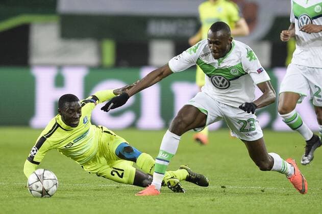 Gent s Nana Asare and Wolfsburg s Josuha Guilavogui fight for the ball during a soccer game between German team VfL Wolfsburg and Belgian club KAA Gent, the return game of the 1 8 final s of the UEFA Champions League competition, Tuesday 08 March 2016 in Wolfsburg, Germany. Wolfsburg won the first leg 2-3. YORICKxJANSENS  x04807161x