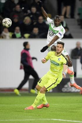 Wolfsburg s Josuha Guilavogui and Gent s Rami Gershon fight for the ball during a soccer game between German team VfL Wolfsburg and Belgian club KAA Gent, the return game of the 1 8 final s of the UEFA Champions League competition, Tuesday 08 March 2016 in Wolfsburg, Germany. Wolfsburg won the first leg 2-3. YORICKxJANSENS  x04807332x