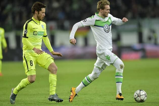 Andre Schurrle midfielder of VfL Wolfsburg is challenged by Matton Thomas midfielder of KAA Gent during the Champions League Round of 16, second leg match between VfL Wolfsburg and KAA Gent at the Volkswagen Arena in Wolfsburg, Germany. FOOTBALL : Wolfsbourg vs La gantoise - Ligue des Champions - 08 03 2016 PHOTONEWS PANORAMIC 