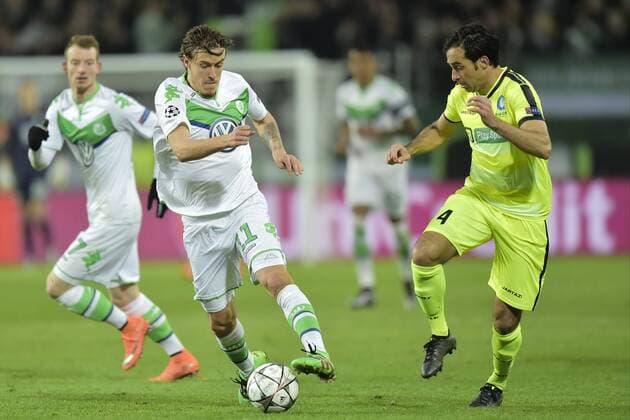 Max Kruse forward of VfL Wolfsburg is challenged by Rafinha Scapini De Almeida Rafael defender of KAA Gent during the Champions League Round of 16, second leg match between VfL Wolfsburg and KAA Gent at the Volkswagen Arena in Wolfsburg, Germany. FOOTBALL : Wolfsbourg vs La gantoise - Ligue des Champions - 08 03 2016 PHOTONEWS PANORAMIC 