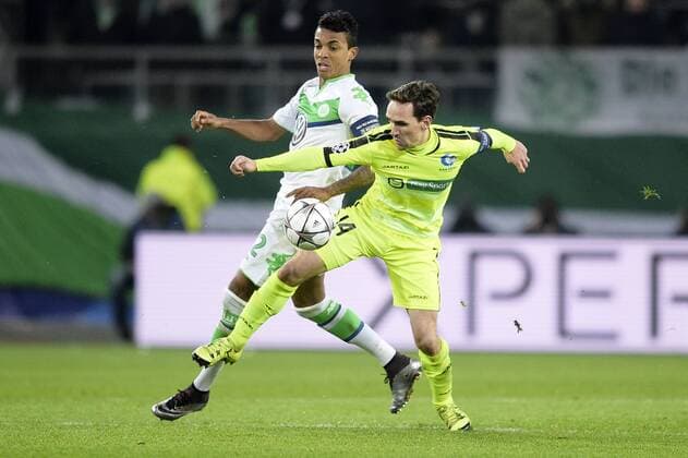 Wolfsburg s Luiz Gustavo and Gent s Sven Kums fight for the ball during a soccer game between German team VfL Wolfsburg and Belgian club KAA Gent, the return game of the 1 8 final s of the UEFA Champions League competition, Tuesday 08 March 2016 in Wolfsburg, Germany. Wolfsburg won the first leg 2-3. YORICKxJANSENS  x04807378x
