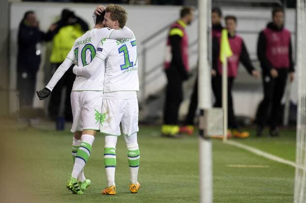 Wolfsburg s Julian Draxler and Wolfsburg s Andre Schurrle celebrate during a soccer game between German team VfL Wolfsburg and Belgian club KAA Gent, the return game of the 1 8 final s of the UEFA Champions League competition, Tuesday 08 March 2016 in Wolfsburg, Germany. Wolfsburg won the first leg 2-3. YORICKxJANSENS  x04807359x