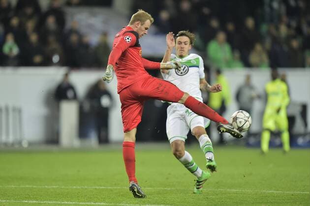 Sels Matz goalkeeper of KAA Gent shoots the ball in front of Max Kruse forward of VfL Wolfsburg during the Champions League Round of 16, second leg match between VfL Wolfsburg and KAA Gent at the Volkswagen Arena in Wolfsburg, Germany. FOOTBALL : Wolfsbourg vs La gantoise - Ligue des Champions - 08 03 2016 PHOTONEWS PANORAMIC 