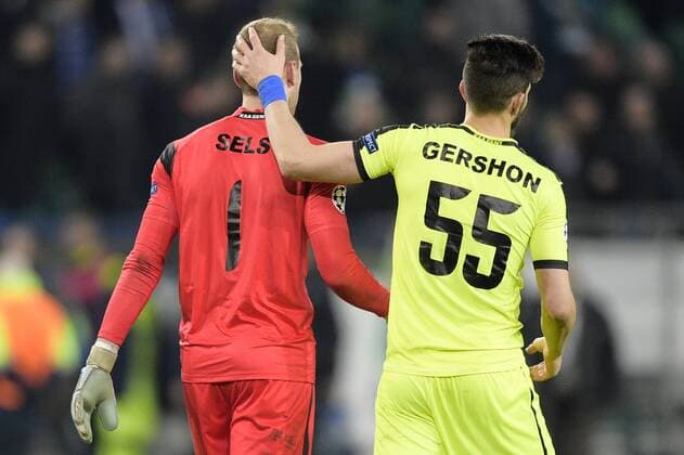 Gent s goalkeeper Matz Sels and Gent s Rami Gershon pictured after a soccer game between German team VfL Wolfsburg and Belgian club KAA Gent, the return game of the 1 8 final s of the UEFA Champions League competition, Tuesday 08 March 2016 in Wolfsburg, Germany. Wolfsburg won the first leg 2-3. YORICKxJANSENS  x04807431x