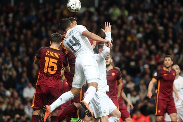 08 03.2016 UEFA Champions League Estadio Santiago Bernabeu Real Madrid CF v AS Roma Casemiro of Real Madrid (number 14) heads first ahead if Miralem Pjanic of AS Roma (left) during the UEFA Champions League last 16 second leg match in Madrid between Real Madrid and Roma at the Estadio Santiago Bernabeu in Madrid, Spain. UEFA Champions League - Real Madrid v Roma UCL_RM_Rma