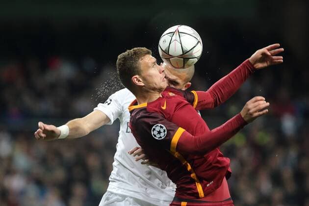 08 03.2016 UEFA Champions League Estadio Santiago Bernabeu Real Madrid CF v AS Roma Edin Dzeko of AS Roma (right) and Pepe of Real Madrid (left) during the UEFA Champions League last 16 second leg match in Madrid between Real Madrid and Roma at the Estadio Santiago Bernabeu in Madrid, Spain. UEFA Champions League - Real Madrid v Roma UCL_RM_Rma