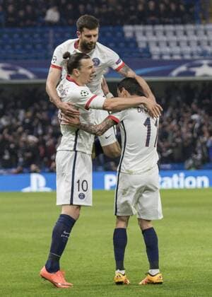 Football - 2015 2016 Champions League - Round of 16, Second Leg: Chelsea 1 vs. Paris Saint-Germain 2 Zlatan Ibrahimovic of PSG (goalmaker) celebrates with team mates after PSG take the lead at Stamford Bridge. COLORSPORT DANIEL BEARHAM  che_psg