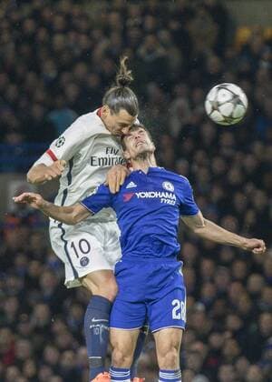 Football - 2015 2016 Champions League - Round of 16, Second Leg: Chelsea 1 vs. Paris Saint-Germain 2 Zlatan Ibrahimovic of PSG rises above Chelsea s Cesar Azpilicueta to win the header at Stamford Bridge. COLORSPORT DANIEL BEARHAM  che_psg