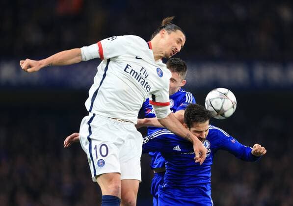 Chelsea s Cesc Fabregas and Gary Cahill tussle with PGS s Zlatan Ibrahimovic - UEFA Champions League - Chelsea vs Paris Saint Germain - Stamford Bridge - London - England - 9th March 2016 - Pic David Klein Sportimage EDITORIAL USE ONLY. No use with unauthorised audio, video, data, fixture lists, club league logos or live services. Online in-match use limited to 120 images, no video emulation. No use in betting, games or single club league player publications.