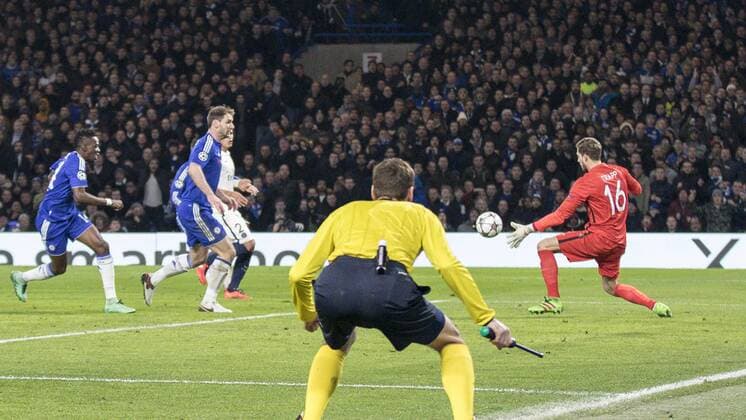 Football - 2015 2016 Champions League - Round of 16, Second Leg: Chelsea 1 vs. Paris Saint-Germain 2 Kevin Trapp of PSG gets a hand to an Eden Hazard shot at Stamford Bridge. COLORSPORT DANIEL BEARHAM  che_psg